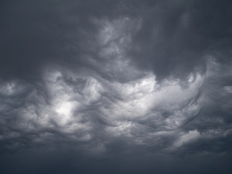 A stunning view of a cloudy sky with thick formations of clouds