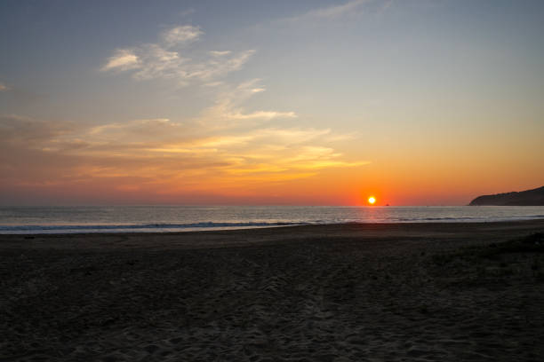 istock Scenic view of sunset over the tranquil sea 1883090253