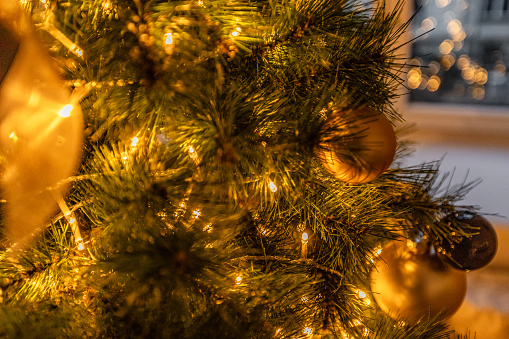 Decorated Christmas Tree, defocused photo with lights