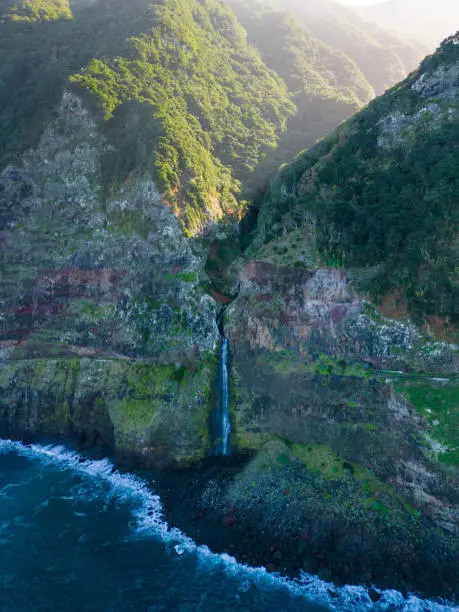 The beautiful view of cliffs and Corrego da Furna waterfall. Madeira, Portugal