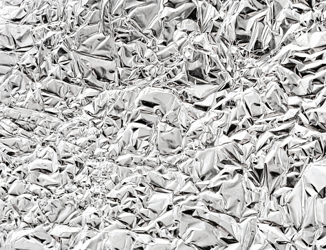 Aluminum foil. The texture almost resembles a liquid when photographed in close-up.