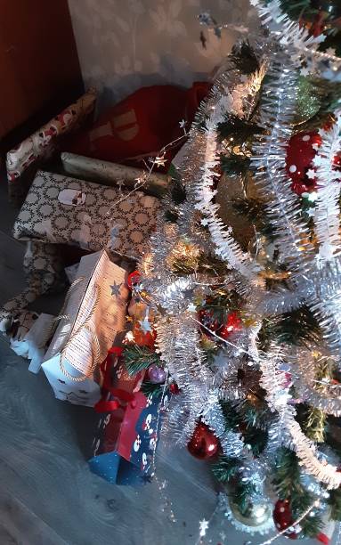istock Christmas tree and christmas presents. 1883176243