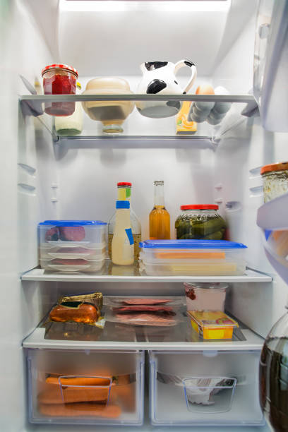 istock Large full refrigerator with foods and drinks. 1883186925