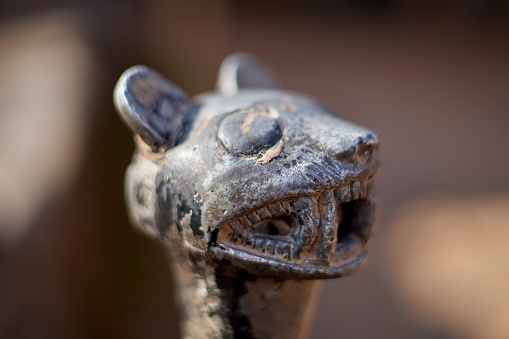 A closeup of Jaguar head metal ornament