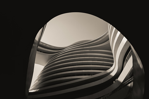 Beijing, China – September 29, 2023: Black and white photograph featuring an exterior shot of a modern building with an impressive curved architectural design, seen from below