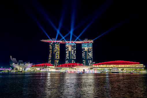 Singapore, Singapore – October 07, 2023: An illuminated helix bridge at night in the Marina Bay area of Singapore