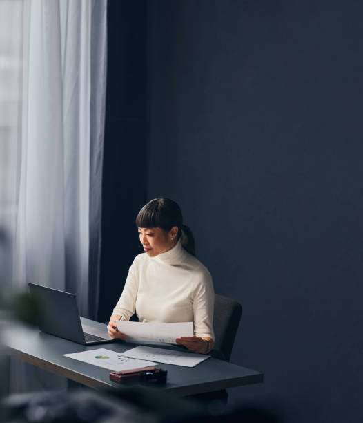 istock A Happy Beautiful Asian Woman Working In The Office On Her Computer 1883286231