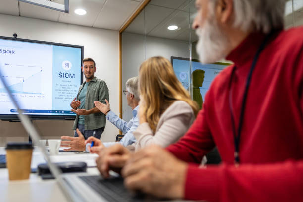 istock Man giving presentation in meeting room 1883321974