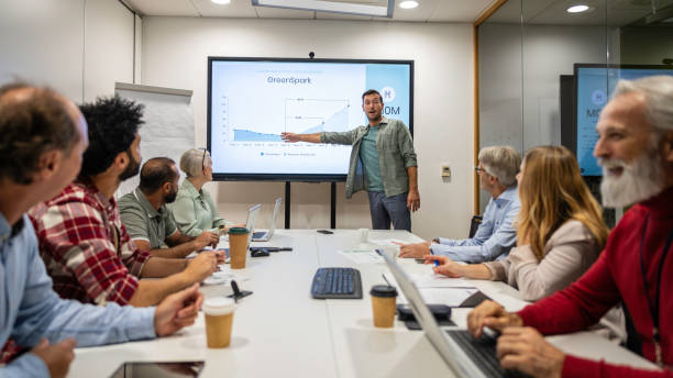 istock Man giving presentation in meeting room 1883321975