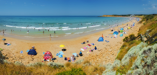 Summertime crowd at Back Beach, Torquay, Great Ocean Road, Victoria, Australia