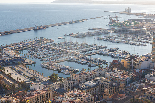 View of the old town of Alicante, the port, and the marina with boats