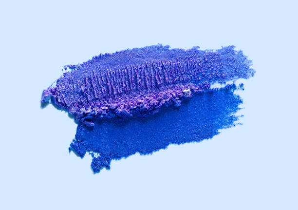 istock Cosmetic smeared creamy liquid blue gray eye shadow or liner swatch on blue background 1883402508