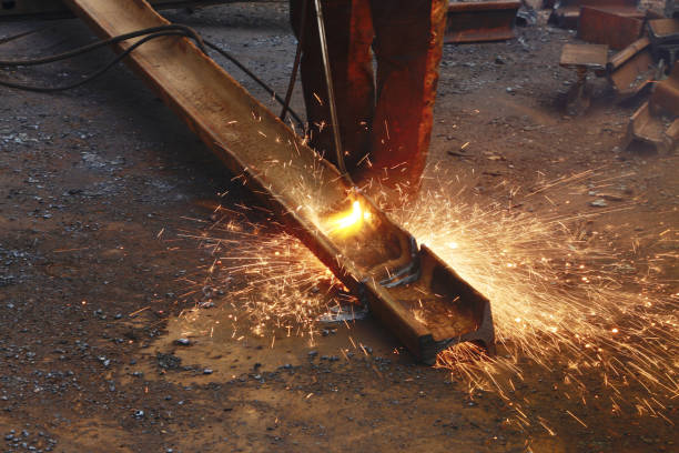 istock A worker cuts an iron rail with an autogen. 1883405858