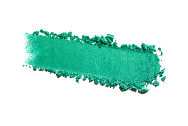 Green blue turquoise ultramarine gray lilac cosmetic smeared eye shadow swatch isolated on white background