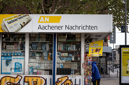 Picture of a sign with the logo of Aachener Nachrichten on their kiosk for Aachen, Germany. The Aachener Nachrichten , or AN for short , was a daily newspaper founded in 1945 and published in Aachen . It appeared together with the Aachener Zeitung in Medienhaus Aachen . Together they had a sold circulation of 71,083 copies, a decrease of 56.6 percent since 1998. In September 2022, the publisher announced that Aachener Zeitung and Aachener Nachrichten would be merged into one paper under the name Aachener Zeitung. However, the content of the two sheets had been identical for years. The last issue of the Aachener Nachrichten was published on March 23, 2023. Since March 24, 2023, the Aachener Zeitung has also had the name Aachener Nachrichten as an additional title. The newspaper was printed in Rhenish format .