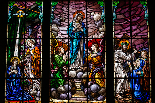 Petropolis, Rio de Janeiro, Brazil - December 17, 2023: Stained glass window illustrating moments in the life of Our Lady in Petropolis Cathedral, a Catholic church dedicated to Saint Peter of Alcantara