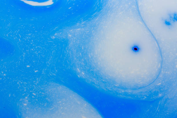 Surface of milk after falling a drop. Close-up of milk splash (shallow DOF).