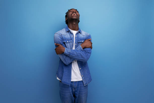 istock frustrated feelings african man with dreadlocks in denim jacket 1883506605