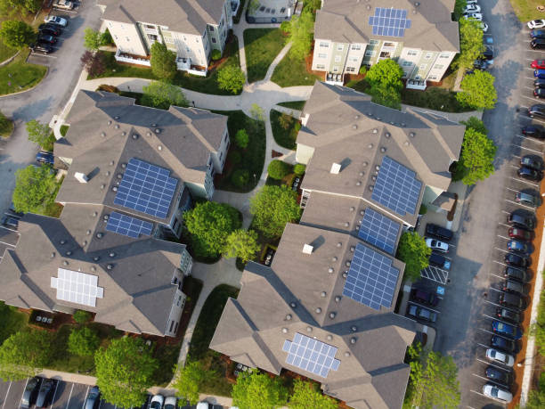 istock aerial view of apartment buildings with solar panel installed on roof 1883544802