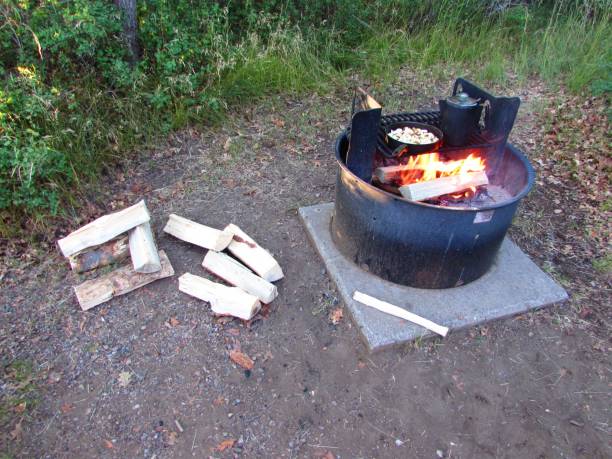 Cooking Breakfast and Coffee in Fire Pit at Campground