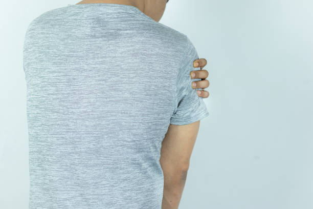 istock Man suffering from shoulder pain on white background 1883700895