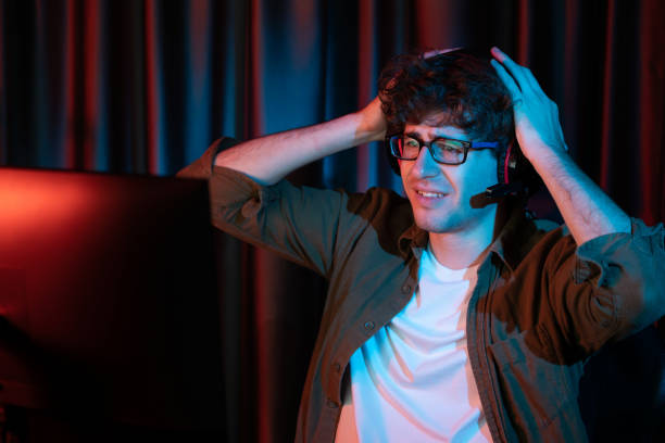 istock Stressful streamer team playing with Esport on computer with hard game. Gusher. 1883736514