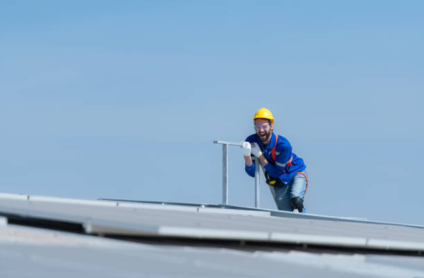 istock A new technician trainee working on solar panels with a fear of heights 1883741646
