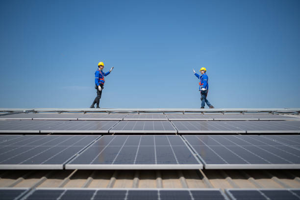 istock Both of technician working on a photovoltaic solar panels 1883747311