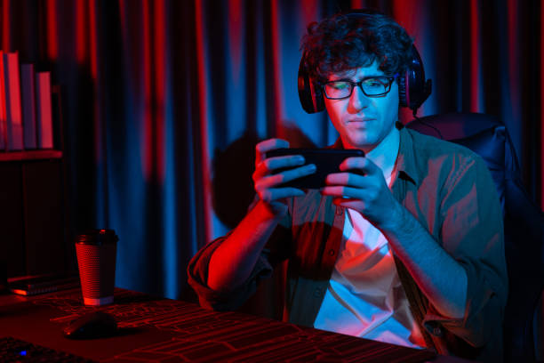 istock Stressful streamer team playing with Esport on phone with harder game. Gusher. 1883798262