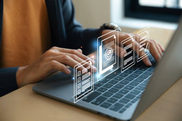 Hand of young man using laptop with document and mark correct sign. Hand using laptop with document and mark correct sign for standard quality control certification assurance concept. form submission stock pictures, royalty-free photos & images