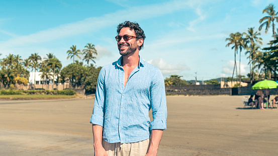 Man wearing sunglasses at the beach