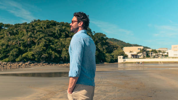 istock A man contemplating the beach 1883840447