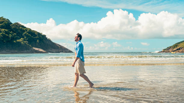 Man walking and contemplating the sea