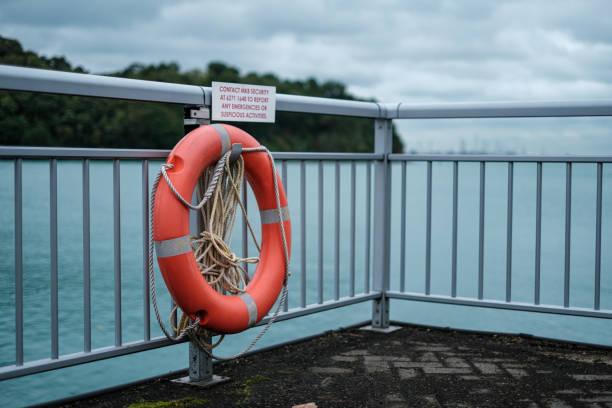 Orange Lifebuoy on Ocean Barricade