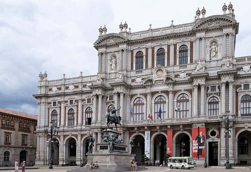 Turin, Italy – Aug 4, 2023 – View of the 19th-century rear facade of Palazzo Carignano on Piazza Carlo Alberto, a historical building, in the city center and renowned for its architectural elegance