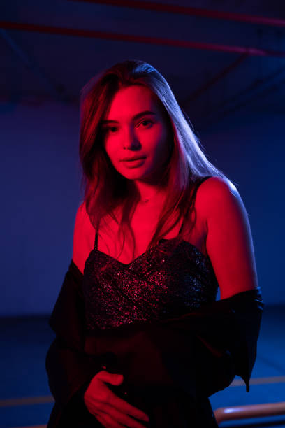 Portrait beauty young asian woman with creative lighting Blue and red or mixed color, colors filters lights with smile face. Attractive Asia girl has long hair Asia lady happy fashion concept