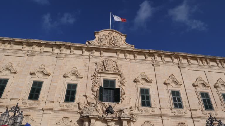 Residence building of the Prime Minister of Malta and Maltese Flag on a roof