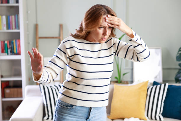 Young woman suffering from vertigo or dizziness problem of brain or inner ear