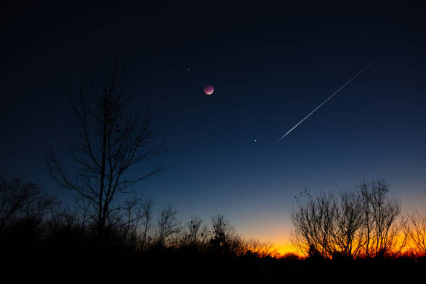 istock Crescent Moon, shooting star, planets and star with landscape silhouettes. 1884221712