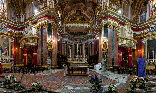 Mdina, Malta - 22 December, 2023: interior panorama view of the lavish and ornate St. Paul's Cathedral in the silent city of Mdina