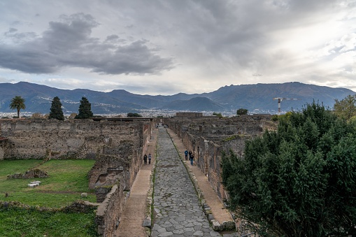 Pompei, Italy - 25 November, 2023: view of the Via Mercurio in the center of the ancient town of Pompeii