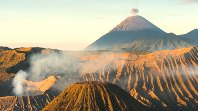 4k Timelapse Movie Sunrise Scene of Moving Cloud, Fog and Smoke of Eruption Cover Volcano Mts. Bromo, Semeru, Batok and Widodaren, Tengger Caldera, Indonesia