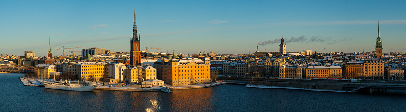 A detailed panoramic shot of the old town of Stockholm in first morning lights in winter on Christmas morning.