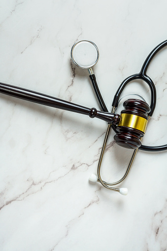 Judge Gavel and stethoscope. Medical law, medical malpractice ruling.