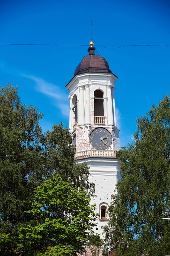 Viborg, Russia - May 30, 2021: The Old Clock Tower of Vyborg, the former bell tower of the cathedral.