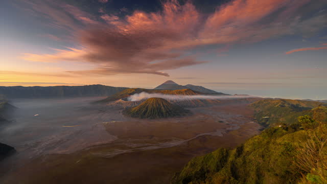 4k Timelapse Movie Night to Sunrise Scene of Moving Cloud, Fog and Smoke of Eruption Cover Volcano Mts. Bromo, Semeru, Batok and Widodaren, Tengger Caldera, Indonesia