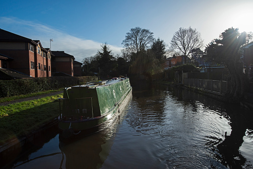 Typically English canal narrow boat with factory