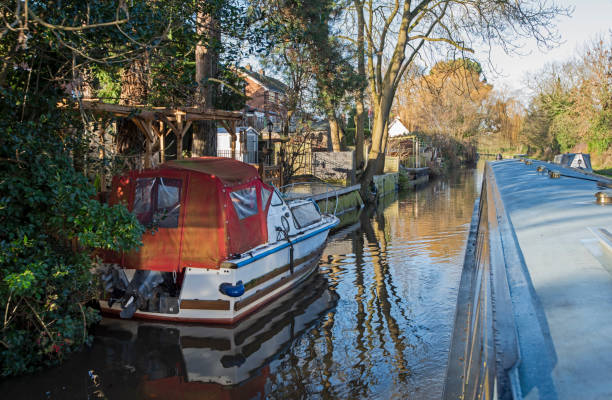 istock Narrowboat on a British canal in rural setting 1884334410