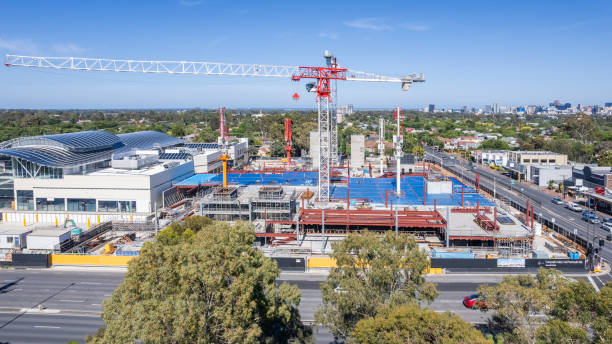 istock Aerial panoramic view retail shopping mall construction site, two tower cranes & equipment in Adelaide's eastern suburbs 1884336946