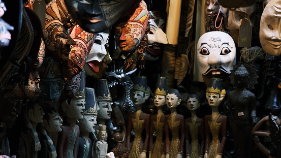 An array of carnival masks and small figurines